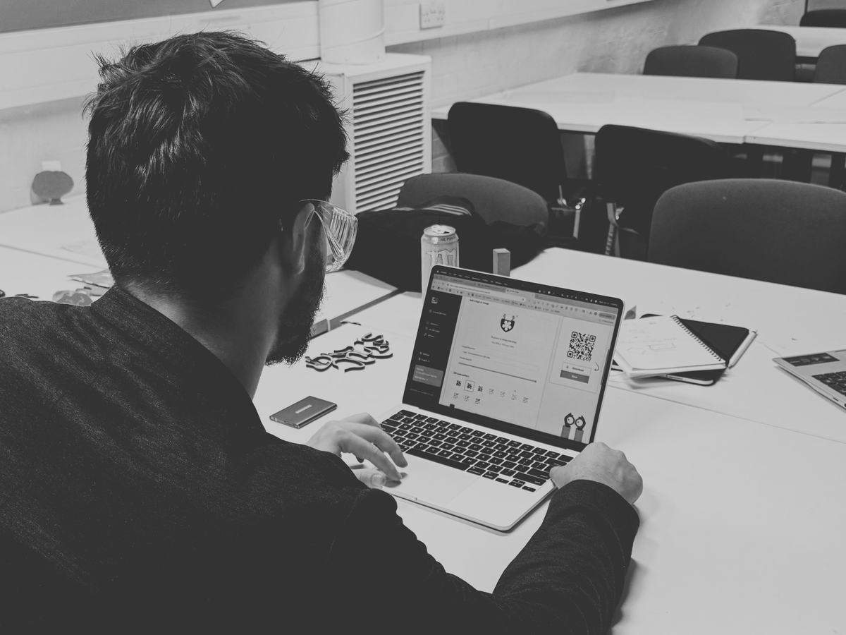 Bennett working at a laptop in the LSBU studio